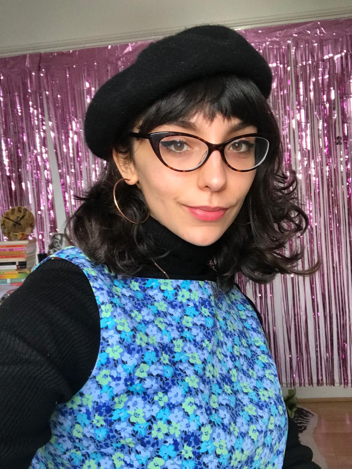 Photo of Ella Clarke with a chic beret on.