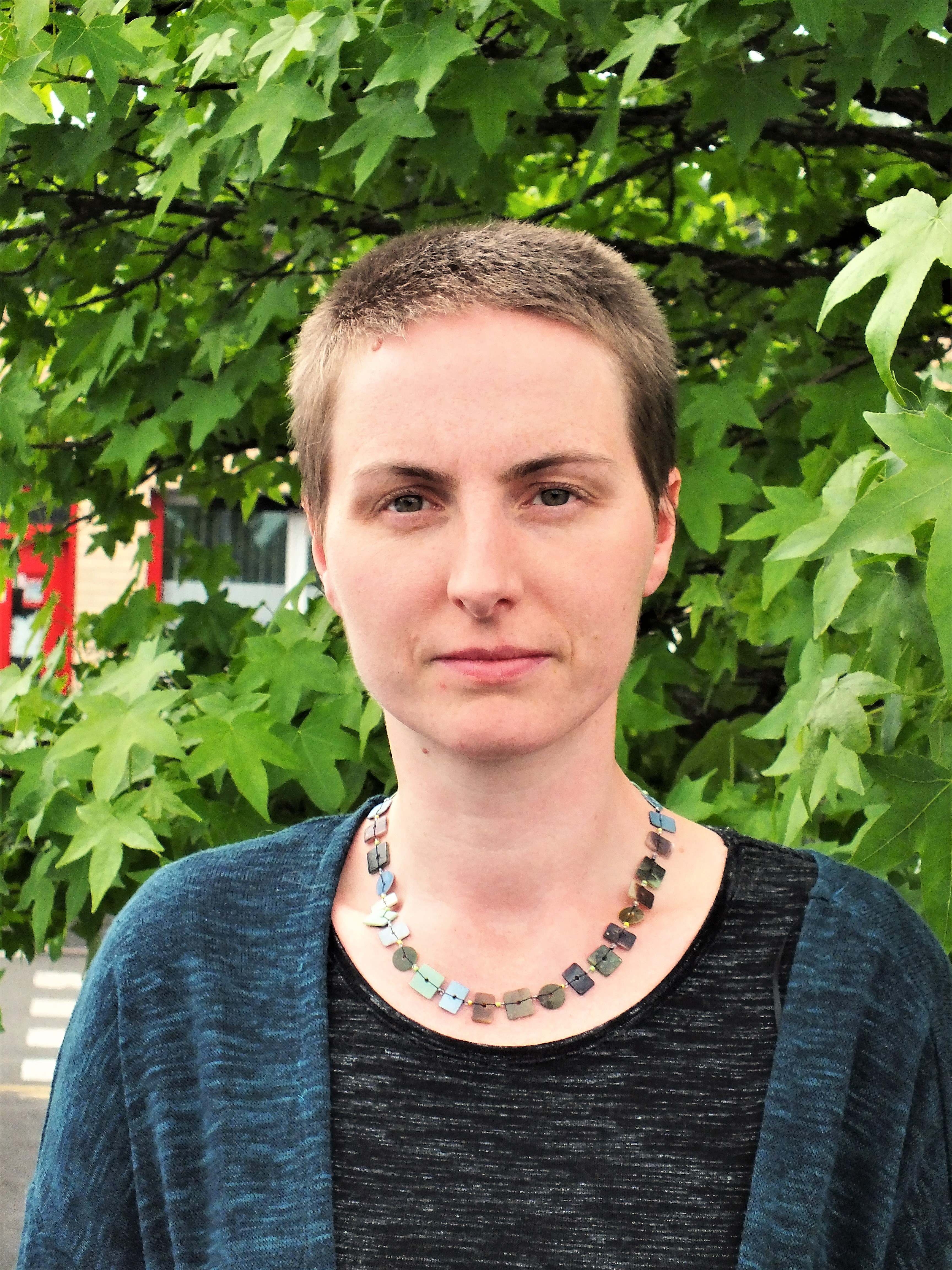 photograph shows Orla, who is a white person with short light brown hair. 