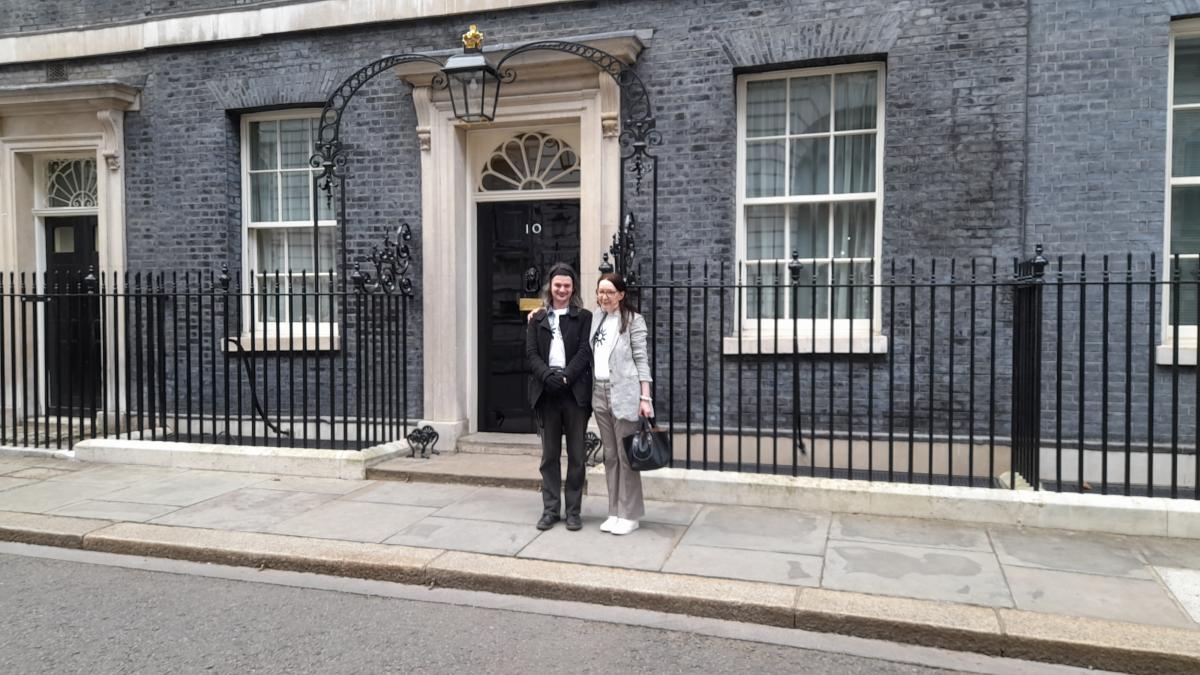 GMCDP board members Helen and Pete standing outside 10 Downing Street. It looks like they've just handed in the petition.